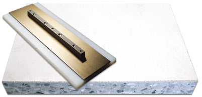 plastic power trowel blade on top of a concrete slab