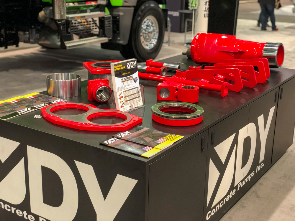 DY Concrete Pumps pump parts and literature being displayed at the World of Concrete event