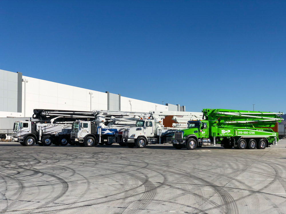 4 DY Concrete Pumps on display outside of the WOC event