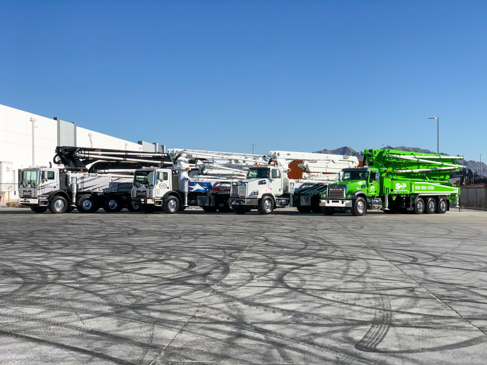 DY Concrete Pumps displaying four of their concrete pumps outside of the WOC event