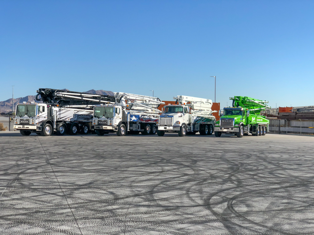 DY Concrete Pumps display some of their concrete pump offerings outside of the WOC event