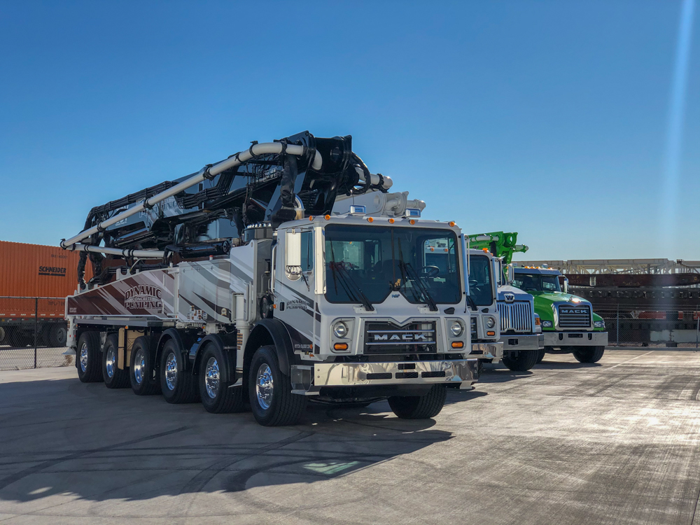 large DY concrete pumps on display outside of the WOC event