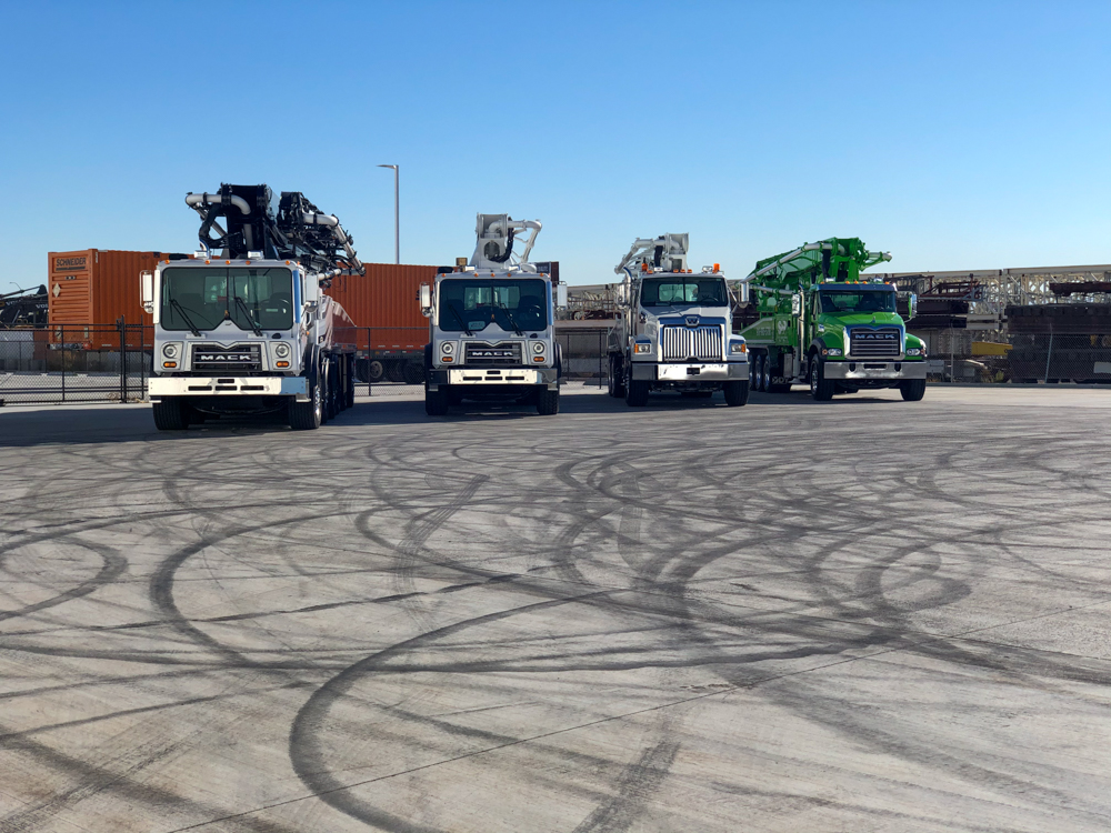 front of 4 DY Concrete Pumps on display at the WOC event