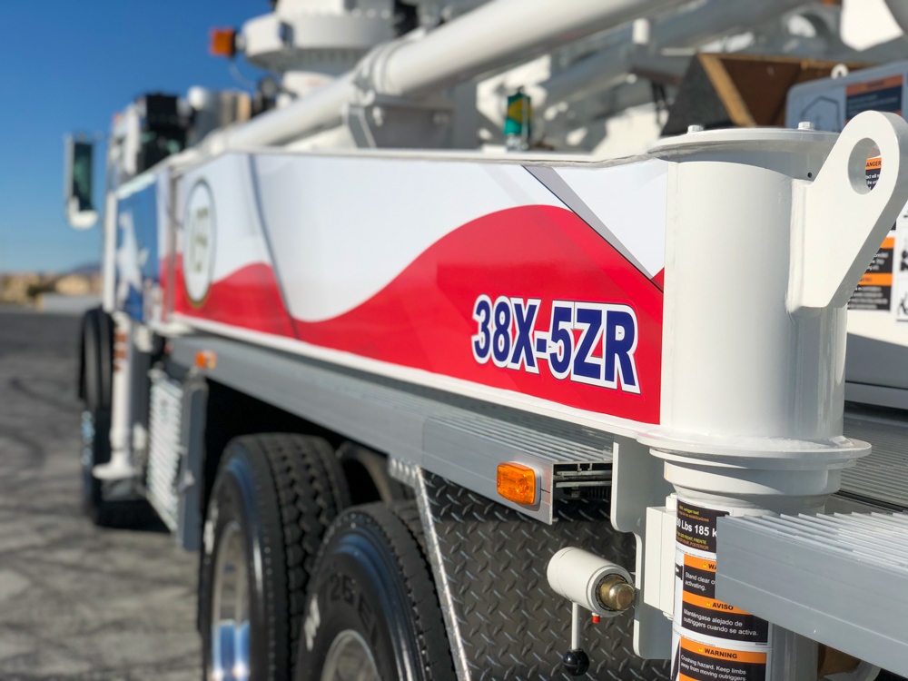 DY Concrete Pumps 38X-5ZR concrete pump model number on the side of a truck at the WOC event