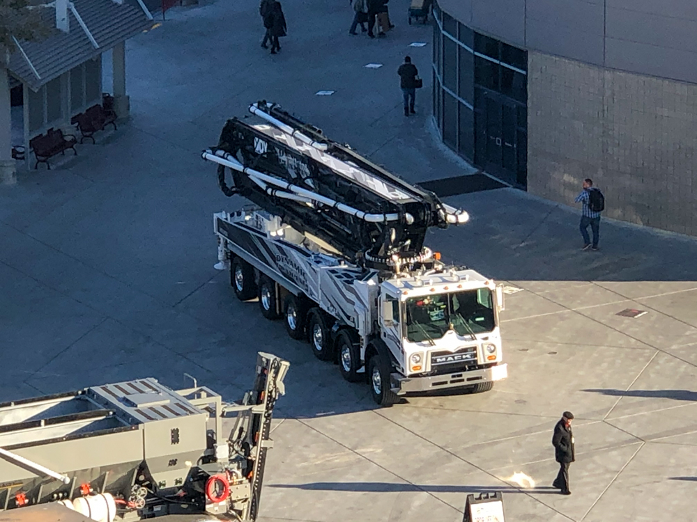 DY concrete pump driving outside around the WOC event