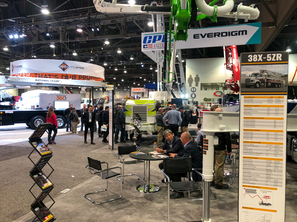 a display explaining the 38X-5ZR concrete pump from DY Concrete Pumps at the WOC event