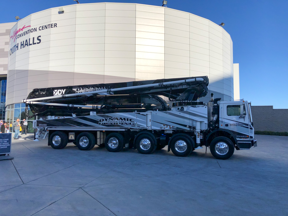 DY Concrete Pumps boom pump manufactured for Dynamic Concrete Pumping on display outside of the convention center at the WOC event
