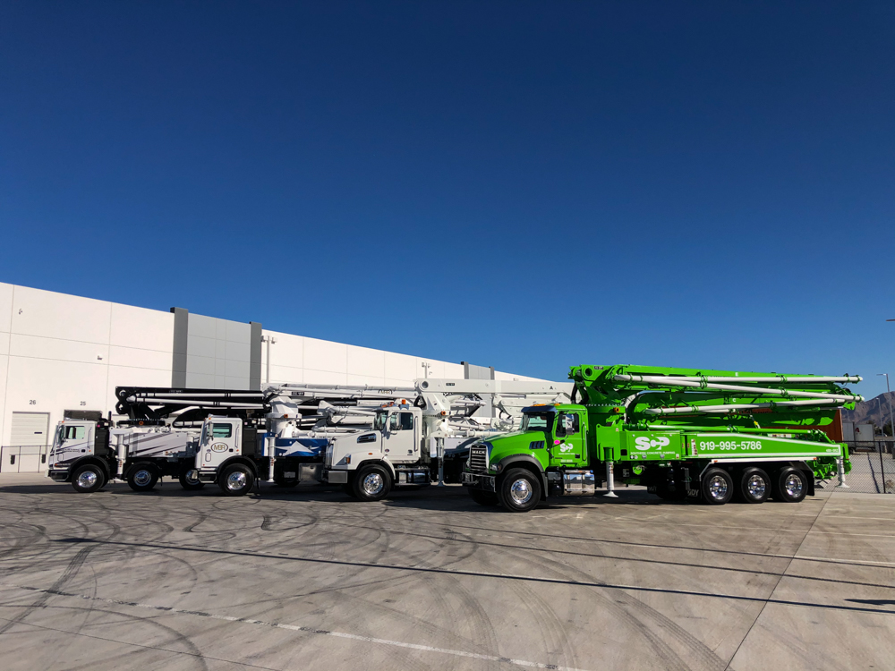 DY Concrete Pumps displaying some of their concrete pumps outside of the WOC event
