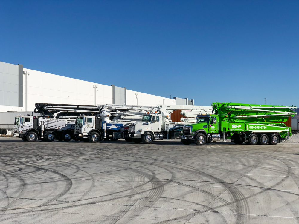 concrete pump trucks manufactured by DY on display at the WOC event
