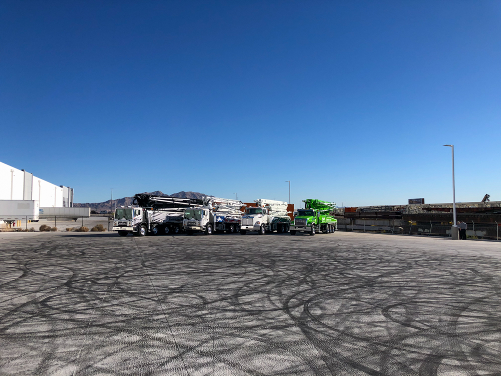 four DY concrete pumps lined up on display at the WOC event