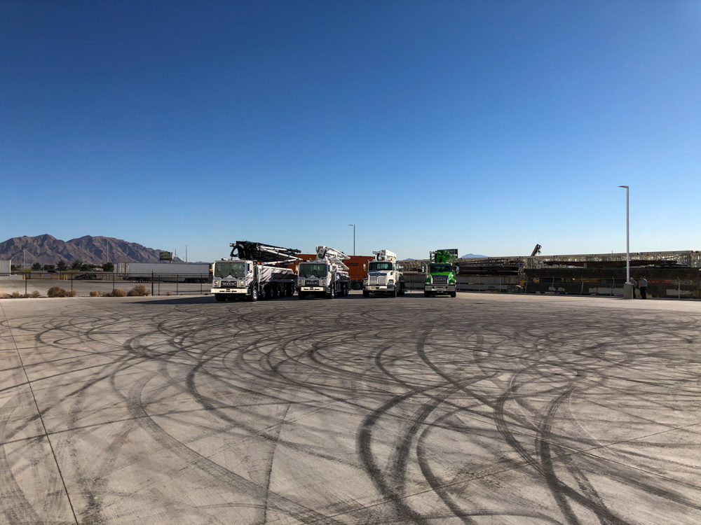 four DY concrete pumps lined up outside of the WOC event