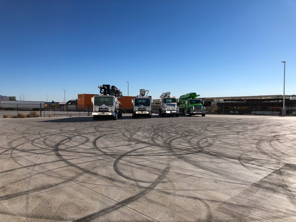 four DY Concrete Pumps boom pumps on display outside of the WOC event