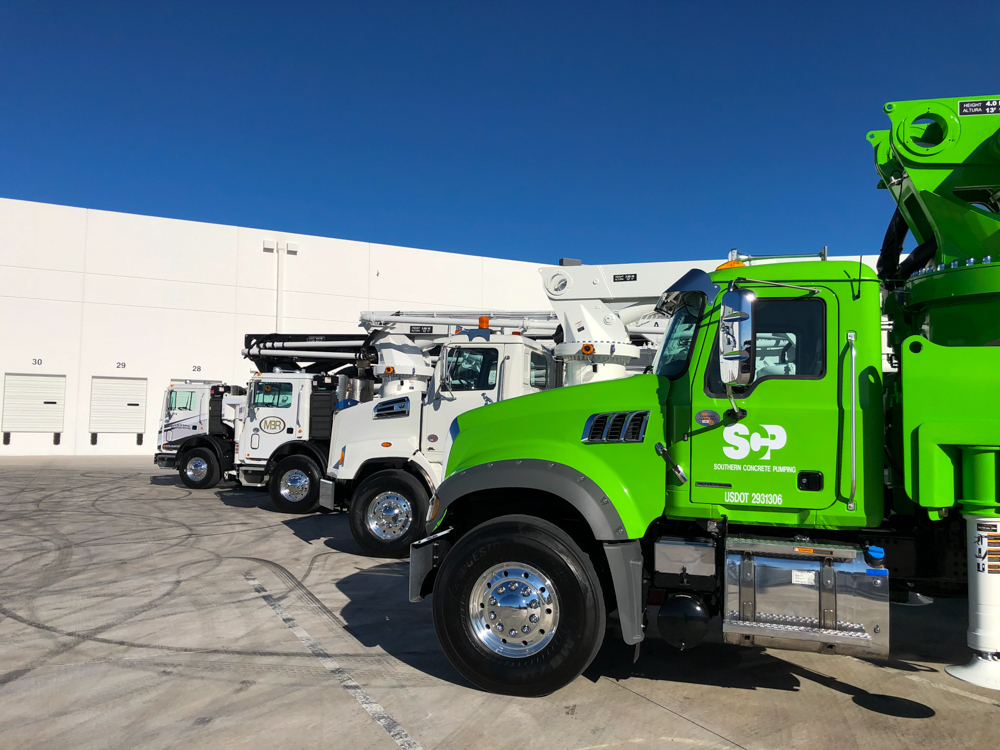 four concrete pumps manufactured by DY Concrete Pumps lined up at the WOC event
