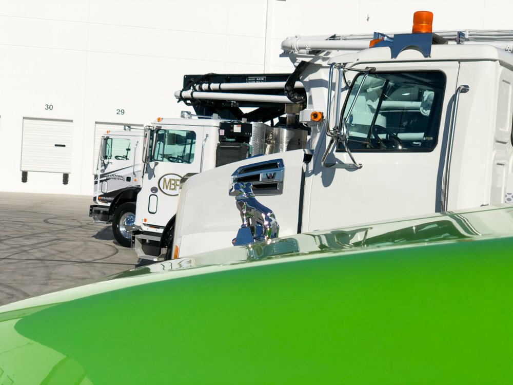 four DY concrete pumps lined up outside of the WOC event
