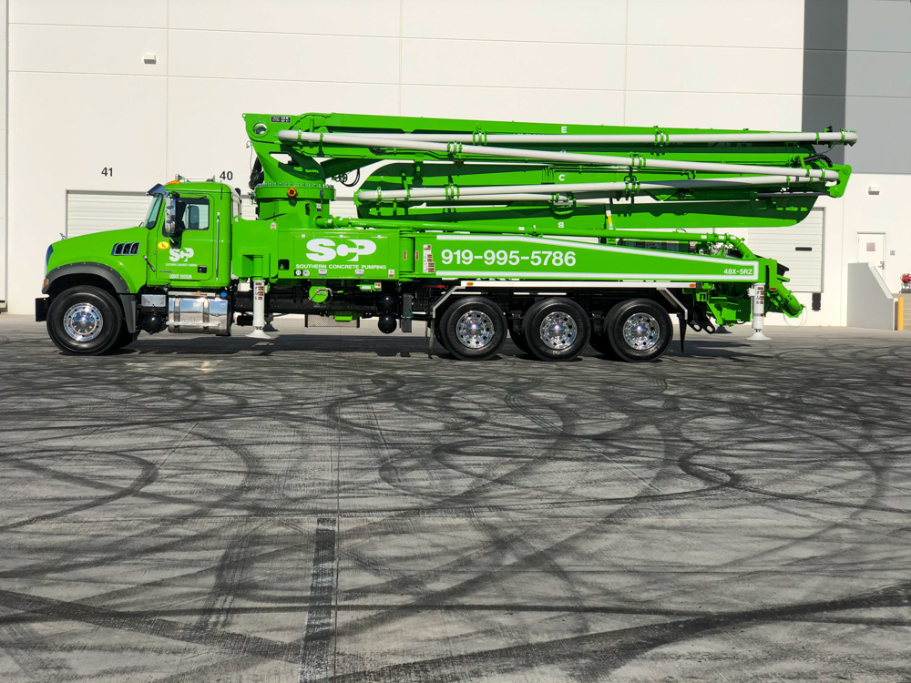 Southern Concrete Pumping green DY concrete boom pump on display at the WOC event