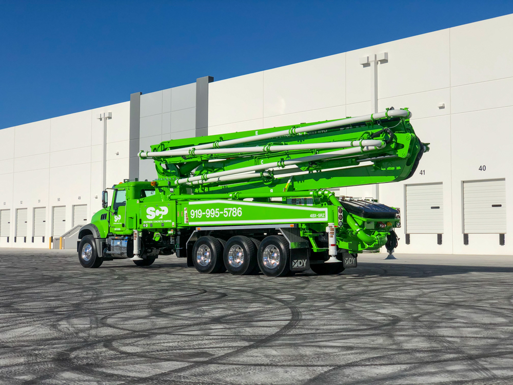 green 48X boom pump manufactured by DY Concrete Pumps at the WOC event