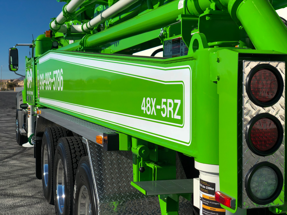 DY Concrete Pumps boom pump model number on the side of Southern Concrete Pumping pump truck