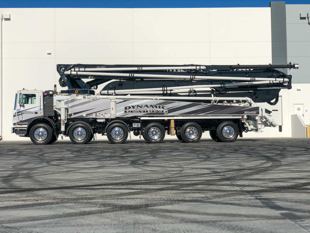 Dynamic Concrete Pumping 57X-6RZ concrete pump outside of the WOC event