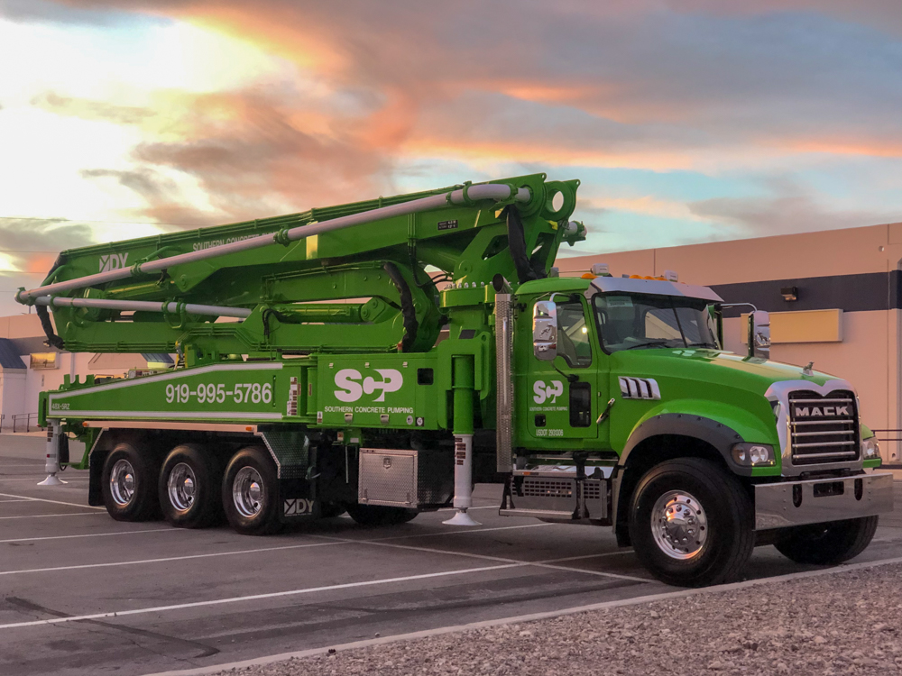 green Southern Concrete Pumping concrete pump truck from DY Concrete Pumps at the WOC event